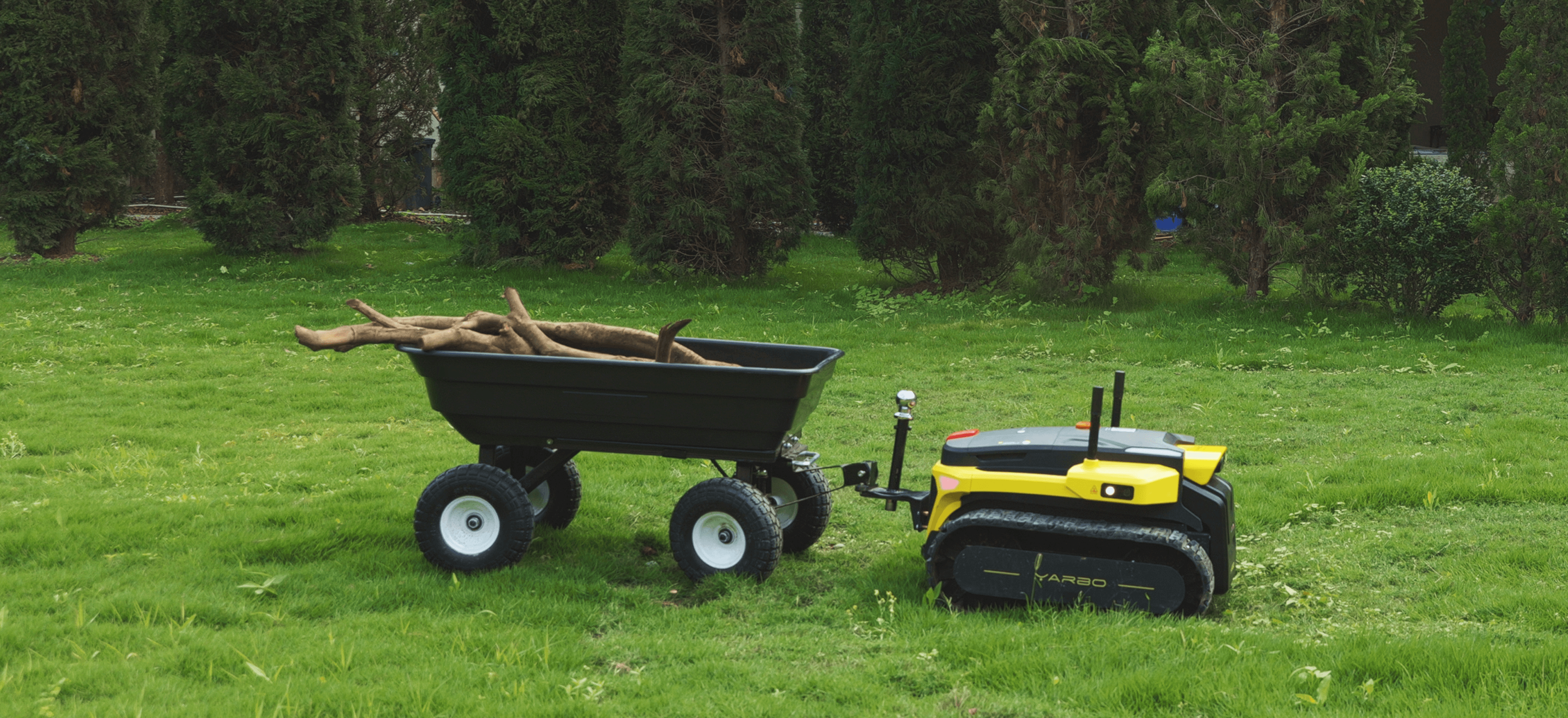 Yarbo core using tow hitch to carry woods