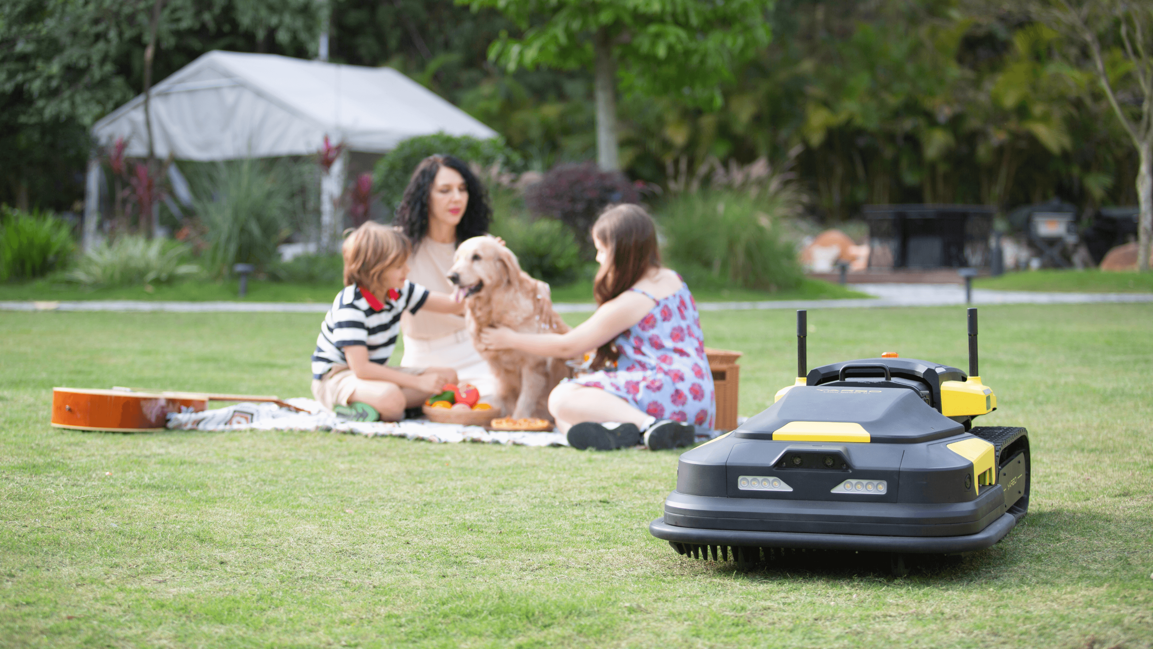 lawn mower robot working on the lawn when a person is going by